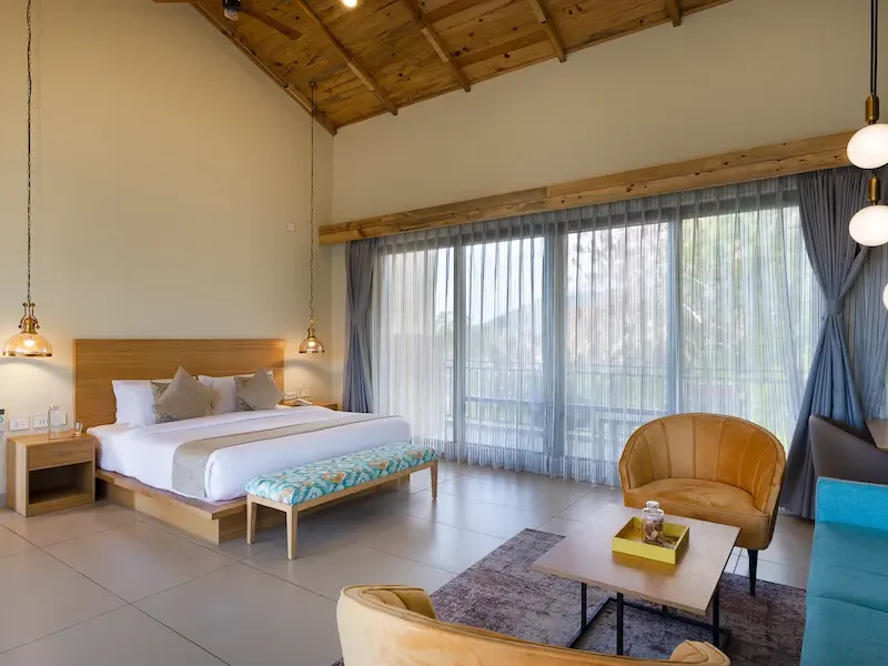 a picture of a bedroom at a resort in palampur