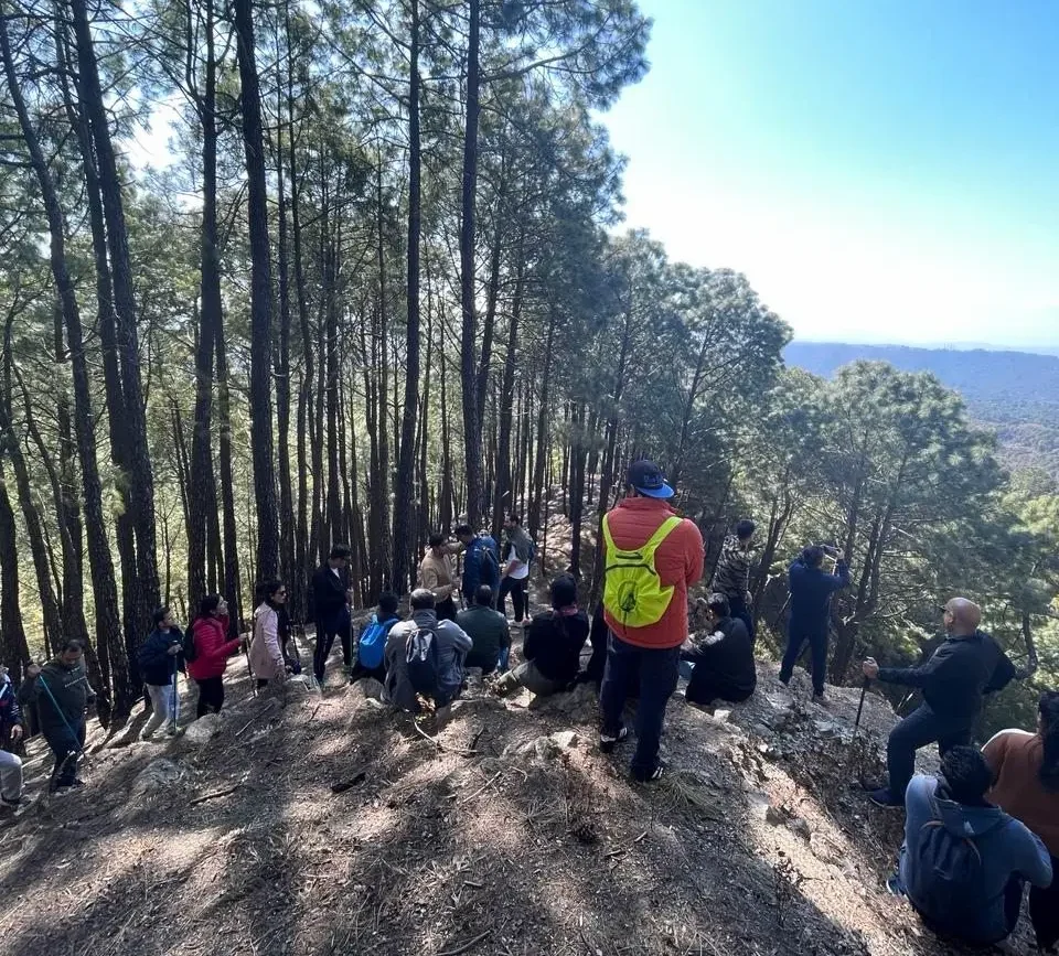 picture of people trekking from a resort in palampur