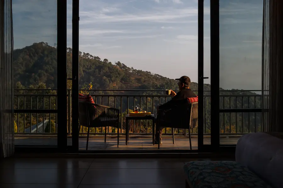 picture of a person sipping tea in the best resort in himachal pradesh