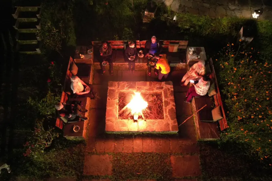 Corporate retreat team at a bonfire evening at Rakkh Resort, Himachal Pradesh.