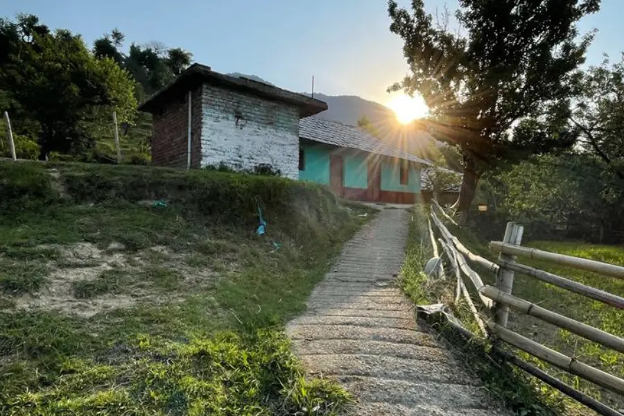 sun rising from behind the mountains