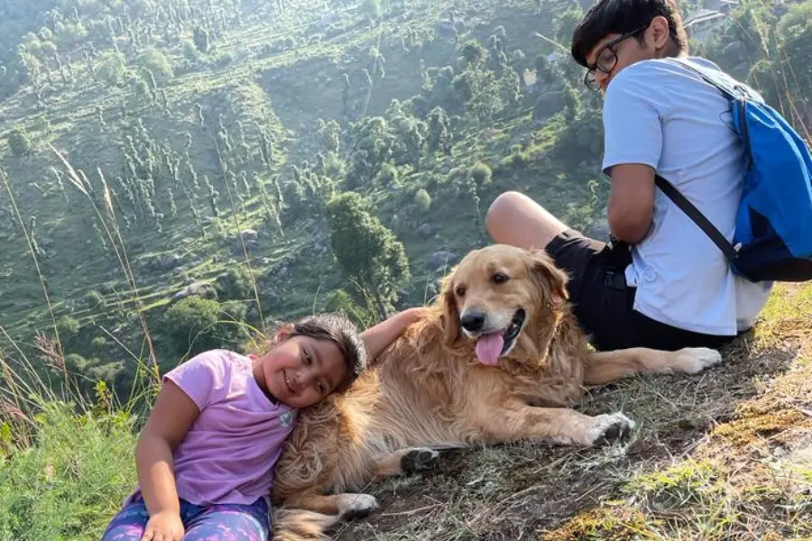 View of kids with dog around the landscape at Rakkh Resorts