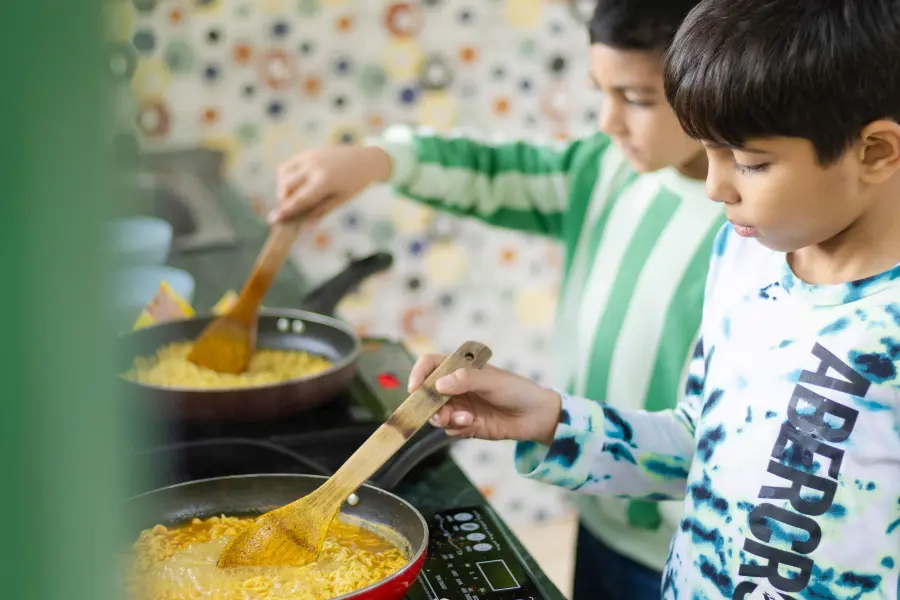 View of kids cooking together at Rakkh Resorts.