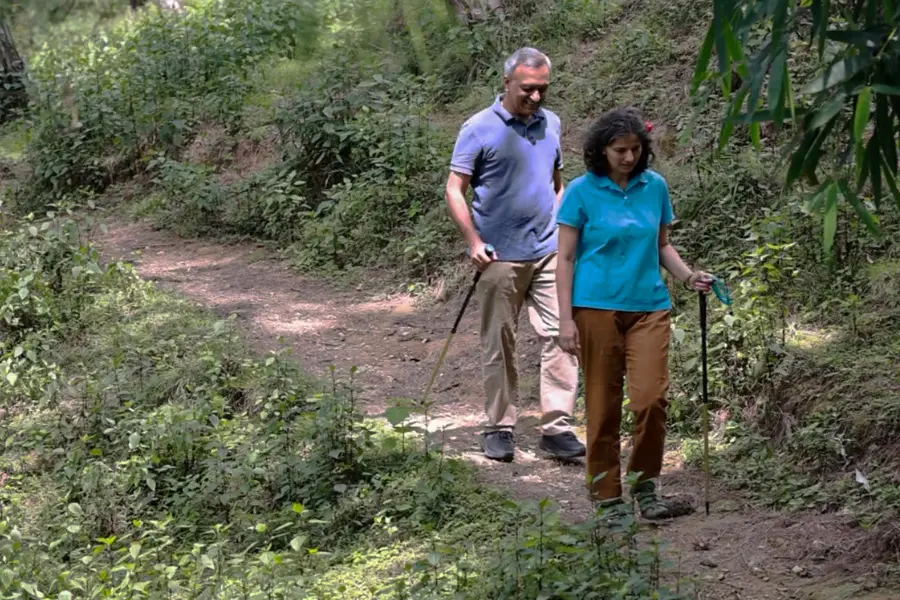 View of a couple trekking near Rakkh Resorts